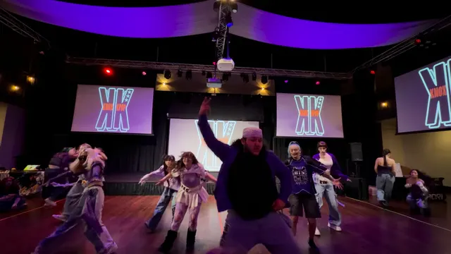 dance crew performing choreography on stage