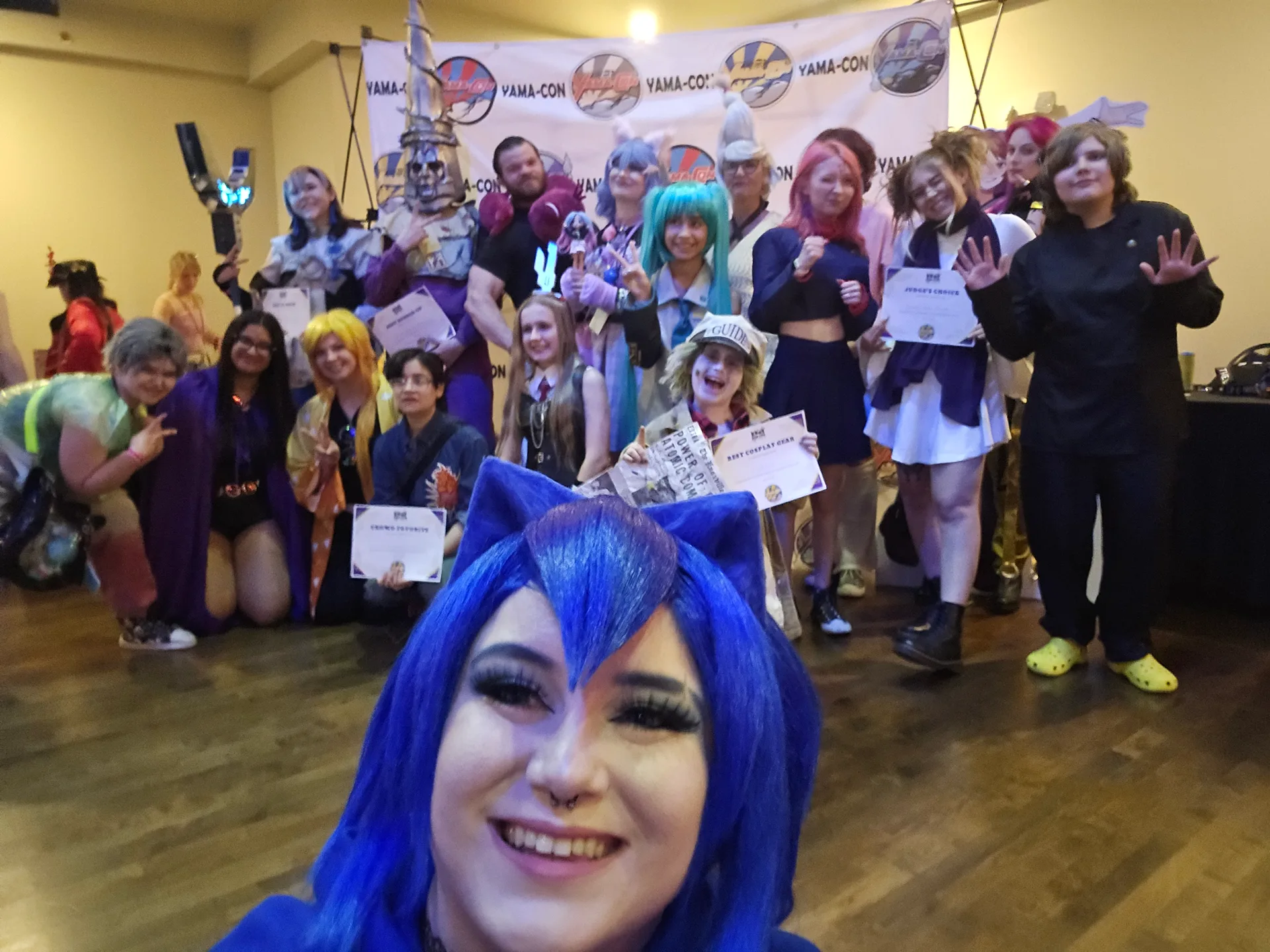Cosplayers with their contest awards at KPC 2026